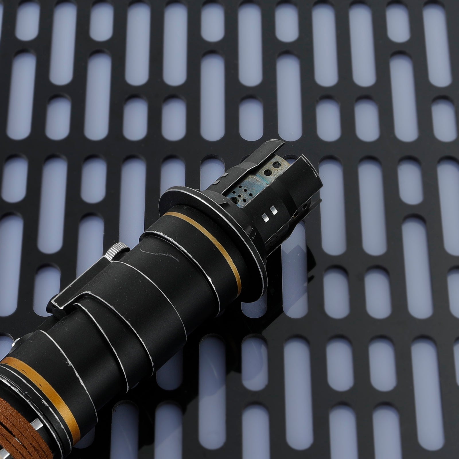 Close-up of Cere Junda Saber Control Box and Leather-style Wrapped Hilt Detail