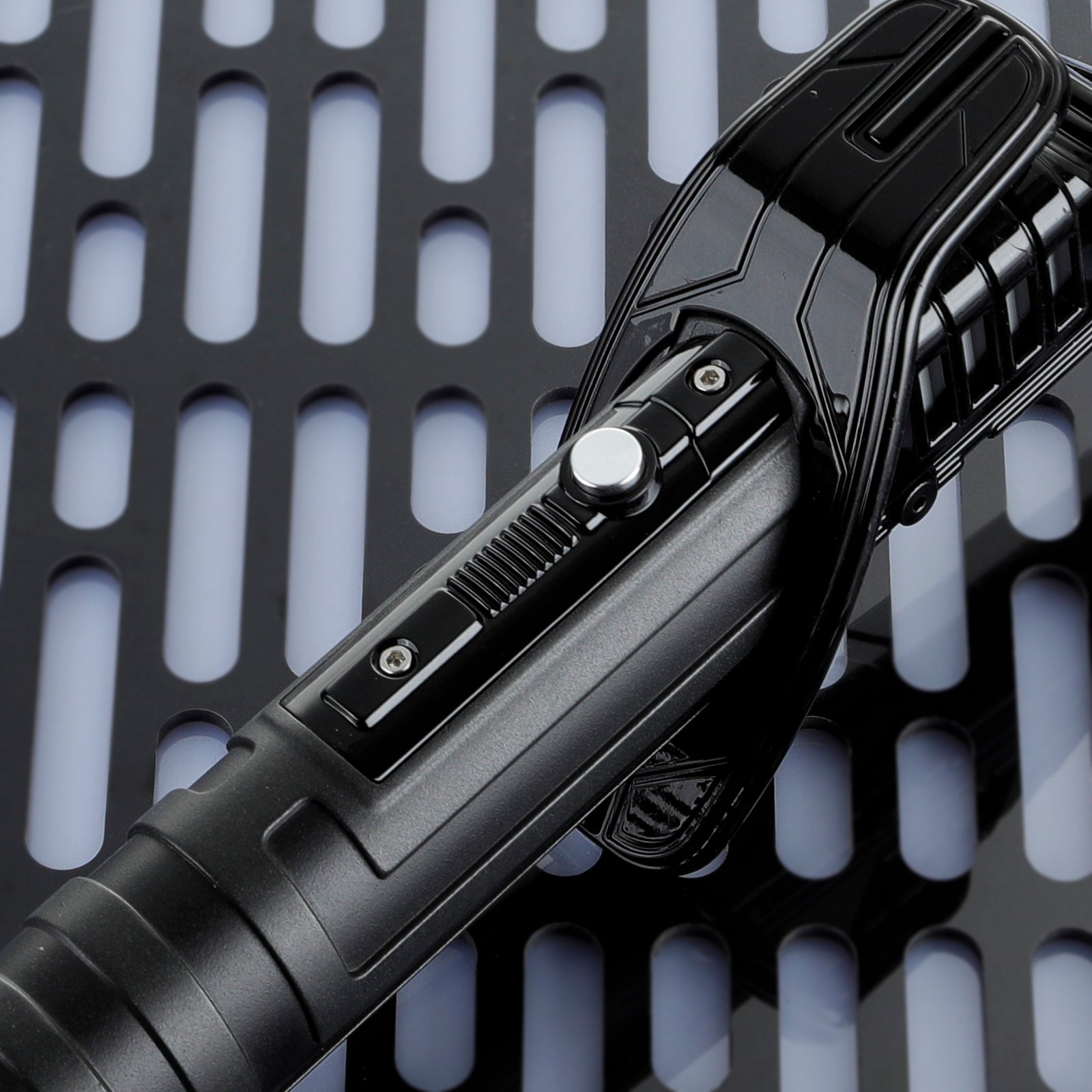 Detailed Frosted Aluminum Hilt of Mandalorian Darksaber showing Power Button