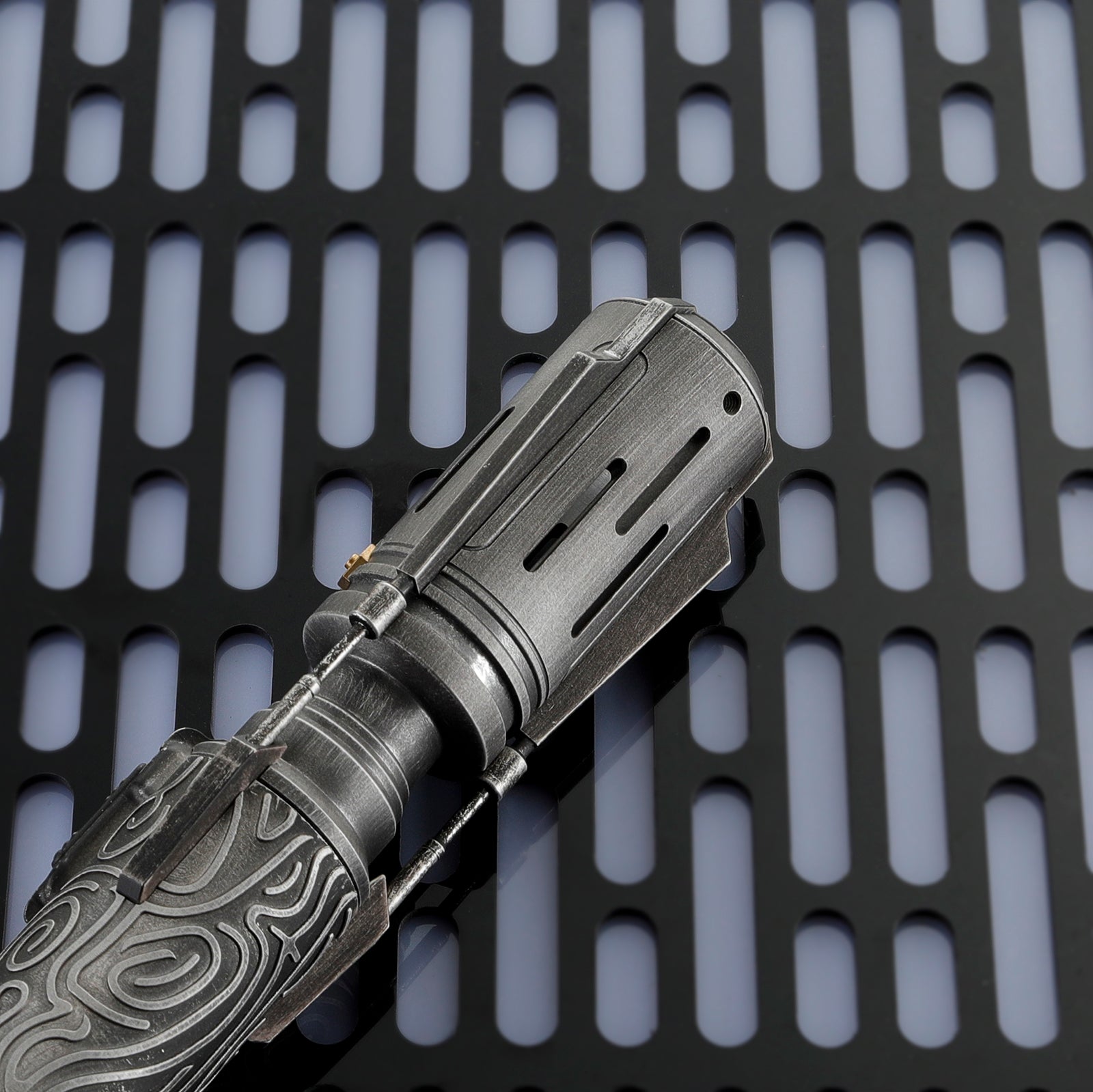 Close-up of Satele Shan Lightsaber Center Connector and Power Button