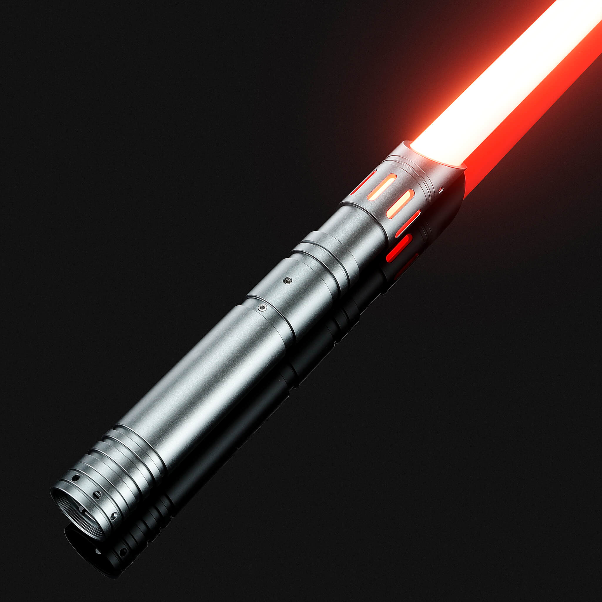 Silver metal hilt FX combat saber igniting a full-contact red heavy dueling blade