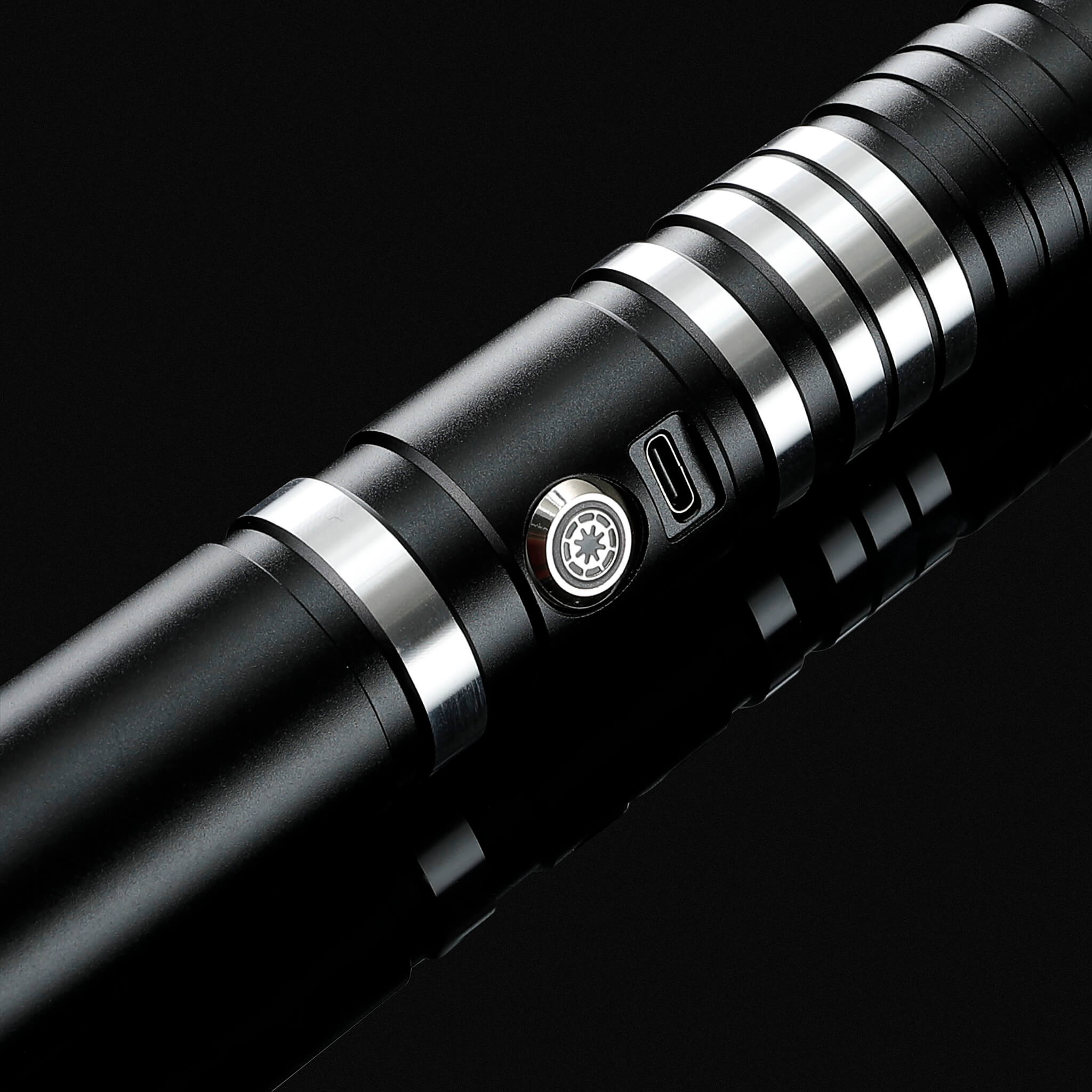 Close-up of the black anodized aluminum alloy hilt with detailed grip design on a premium light saber.