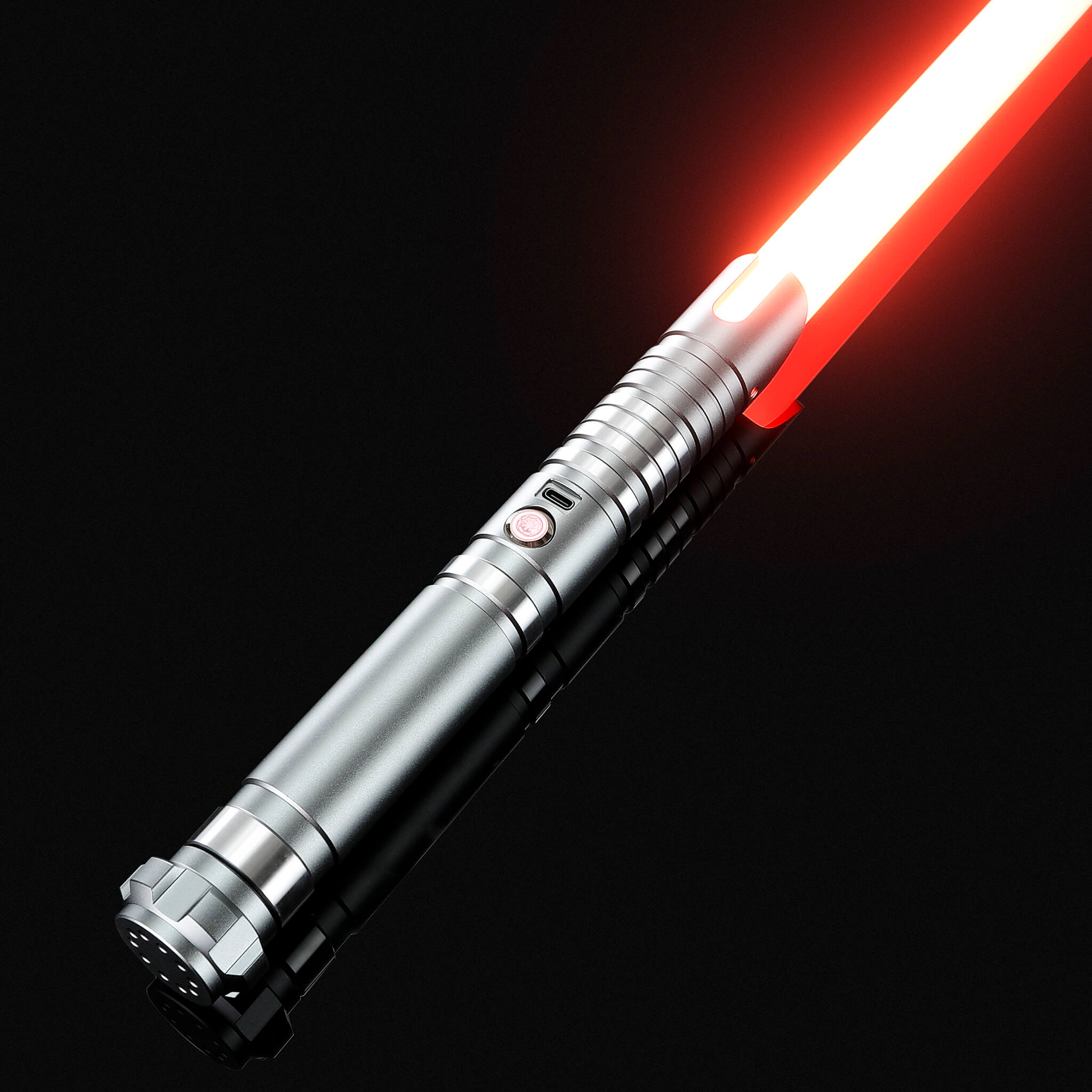 Silver metal hilt replica light saber glowing with a bright red blade.