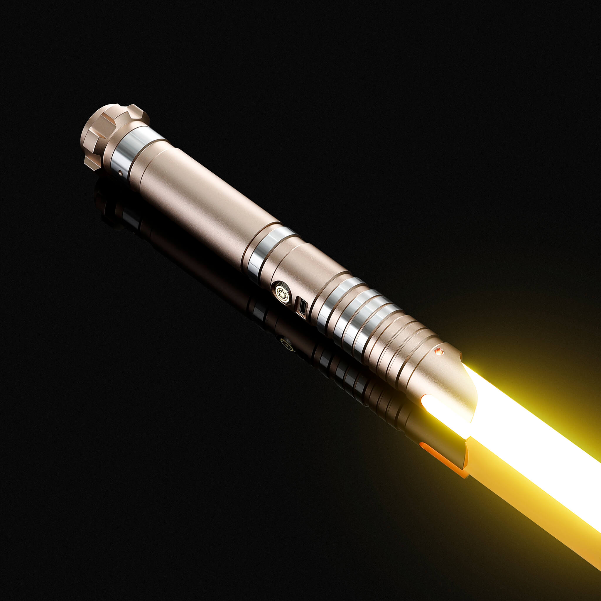 Side angle of the gold handle premium cosplay light saber glowing with a bright yellow light.