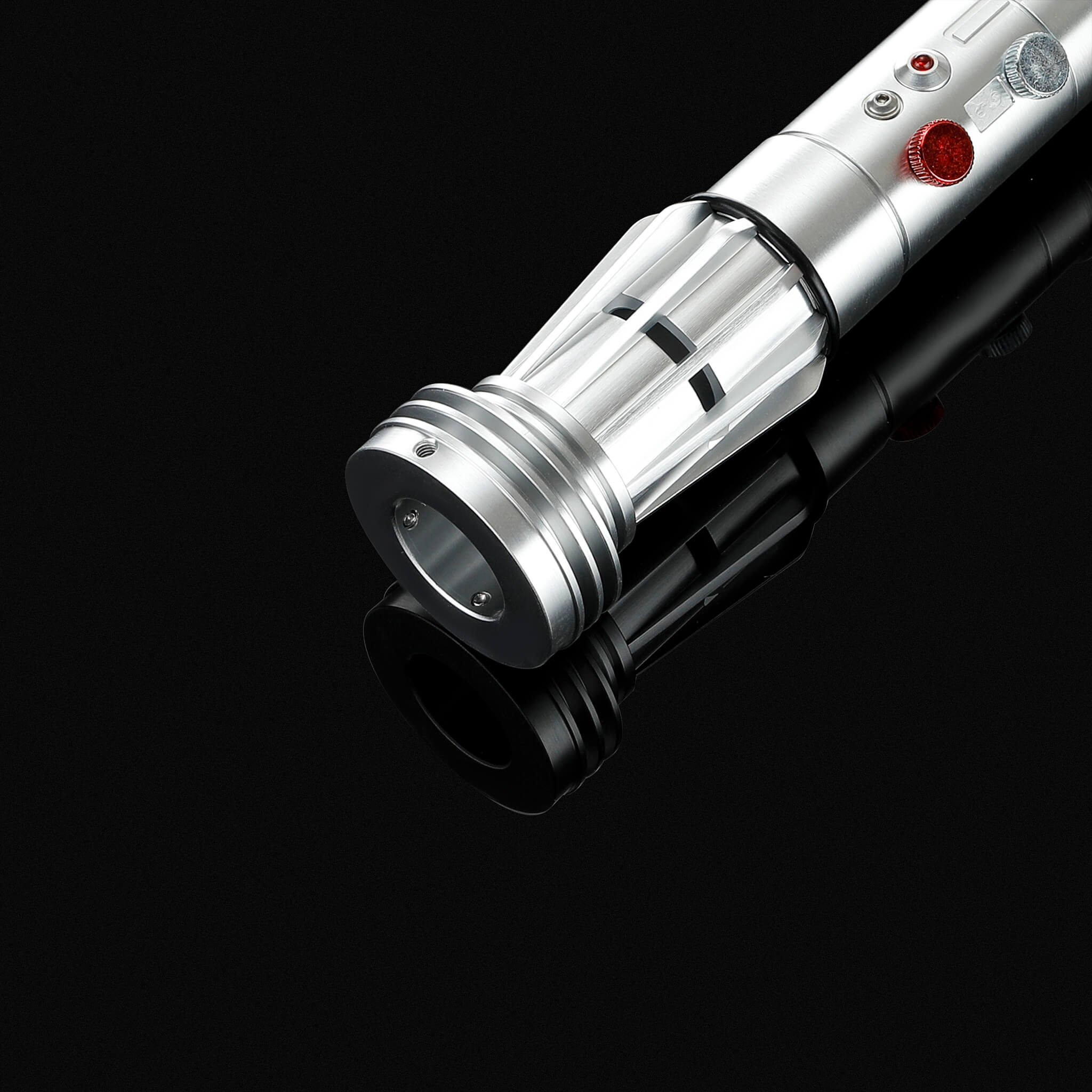 Close up of Ventress style metal lightsaber emitter with red button