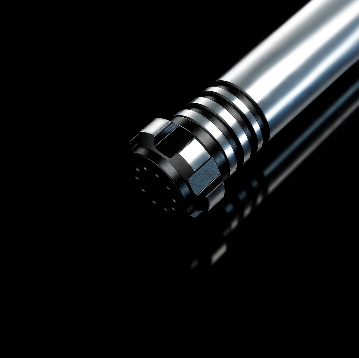 Grooved Pommel and Speaker Vent Detail of Lightsaber Hilt