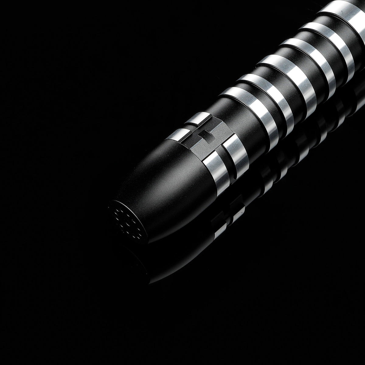 Lightsaber hilt pommel and speaker grille detail