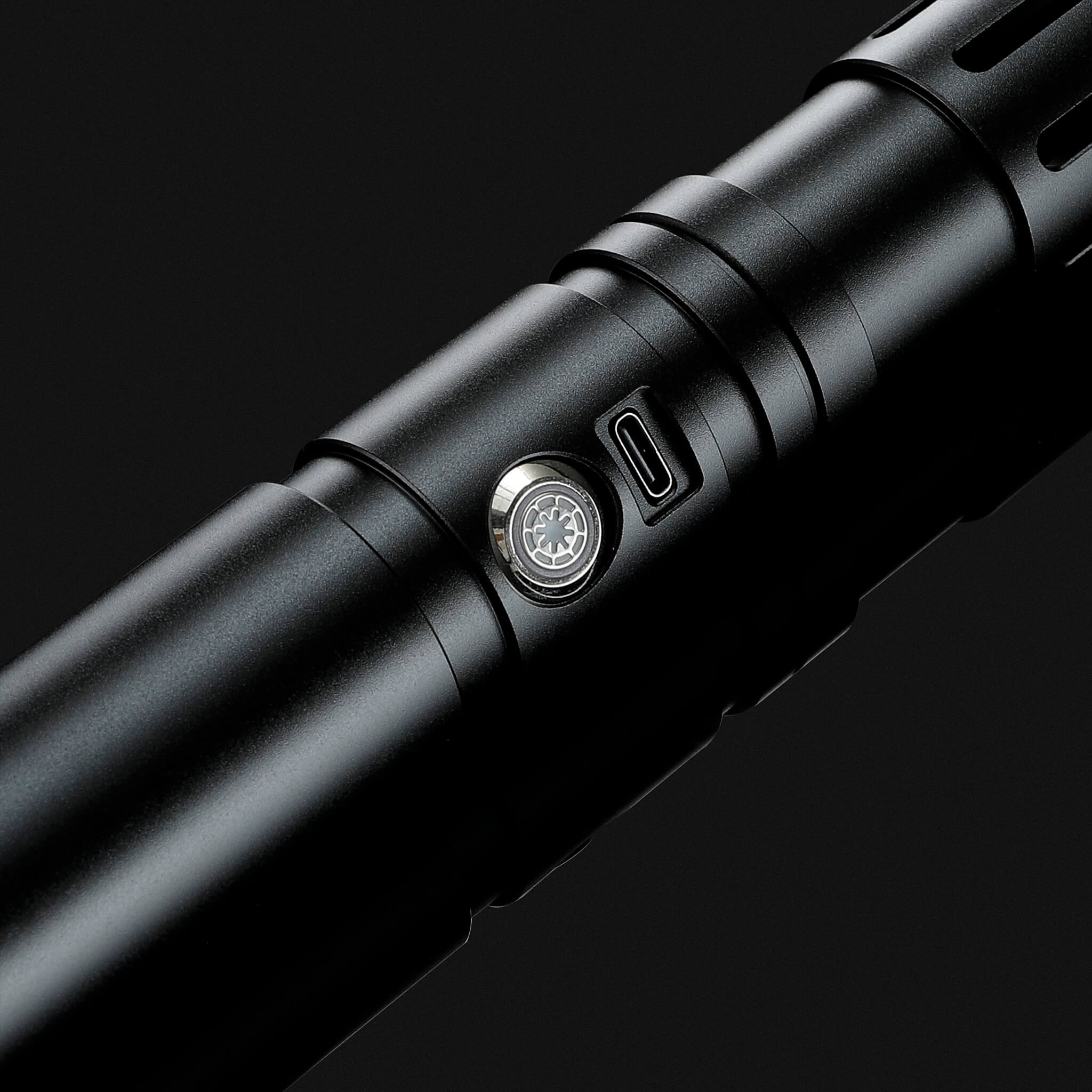 Close-up of premium black metal hilt showing tactical power button and Type-C charging port