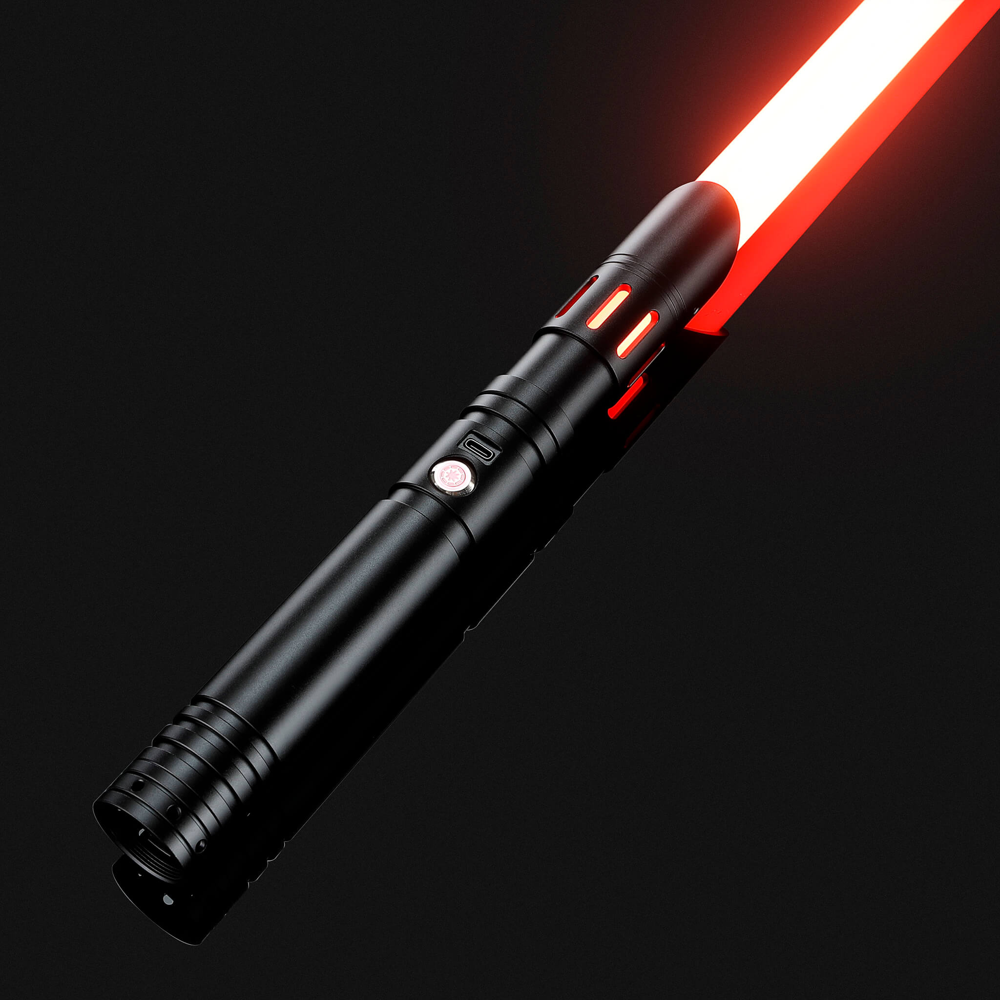 Black aluminum FX combat saber laying down with a fiery red dueling blade ignited
