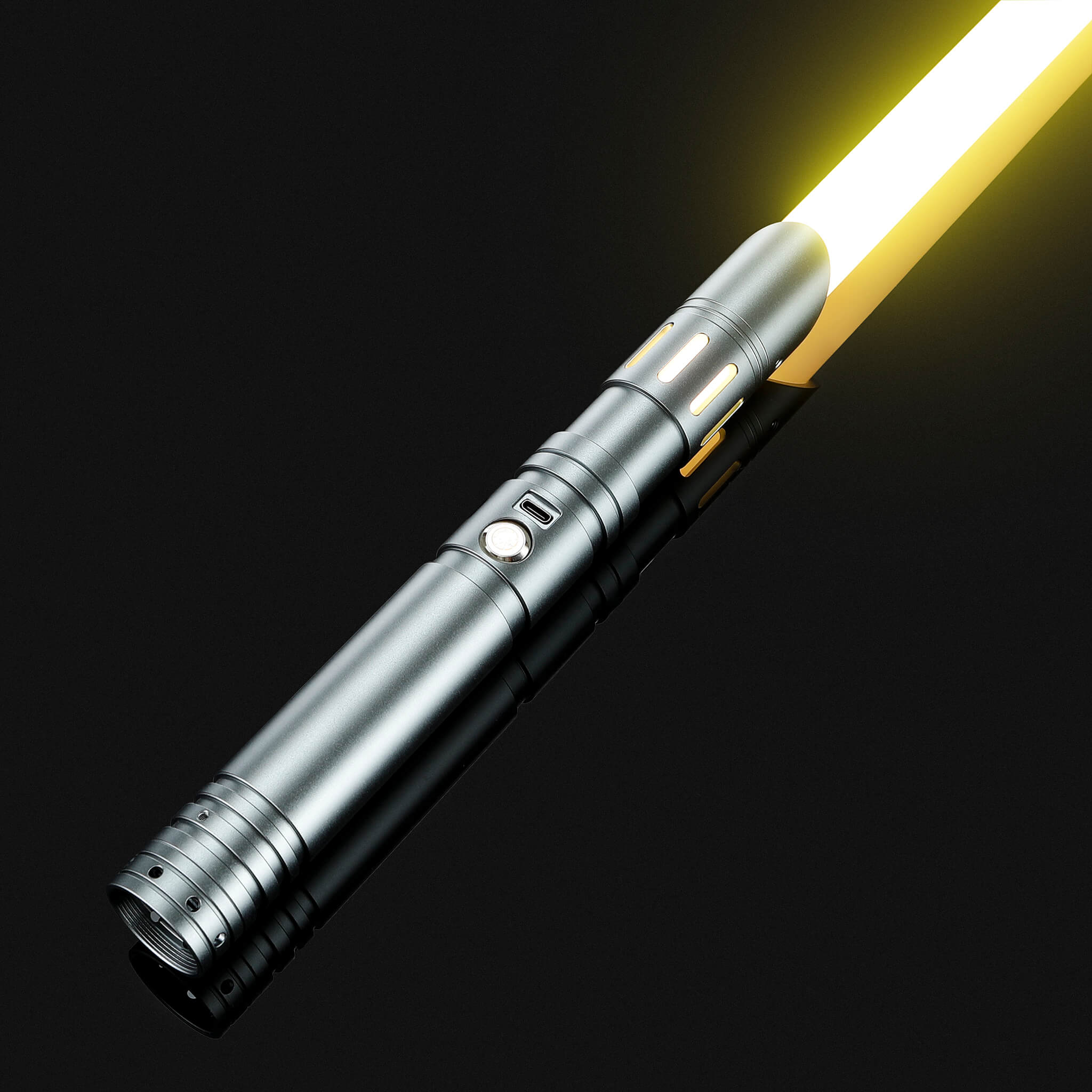 FX dueling saber with metallic silver handle igniting a vibrant yellow combat blade