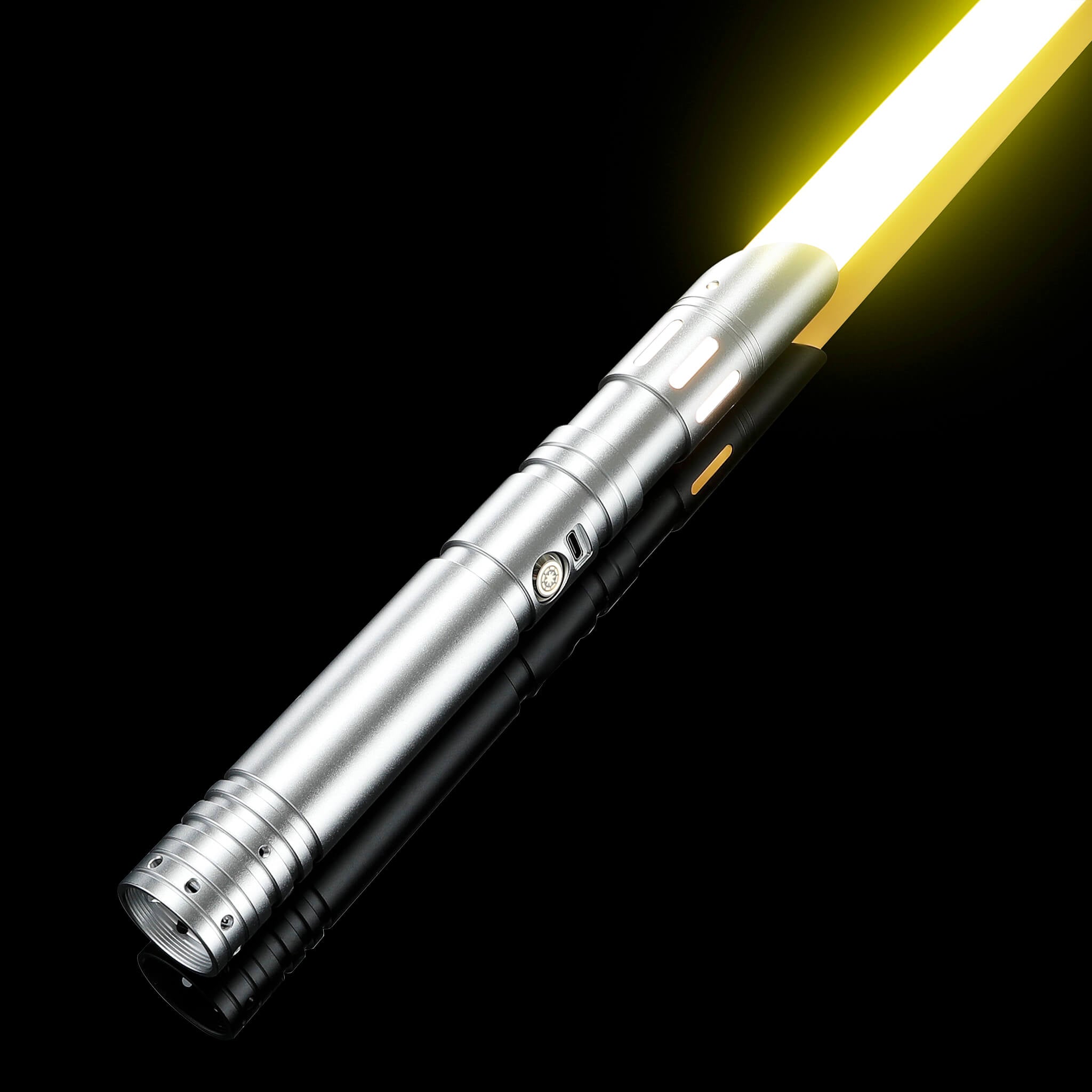 Ergonomic silver metal hilt light saber igniting a brilliant yellow combat blade