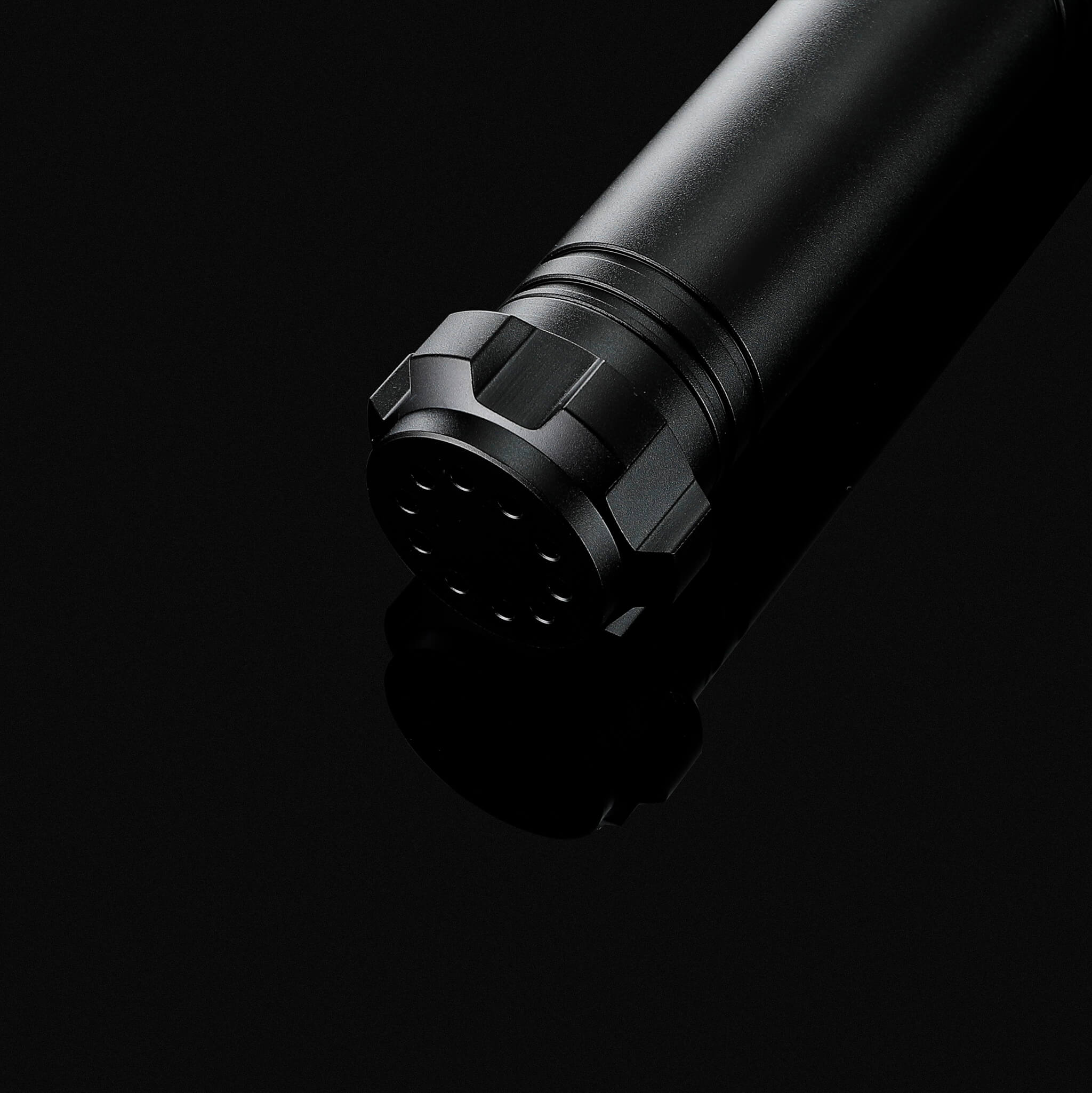Detailed view of the premium perforated combat pommel for enhanced sound resonance
