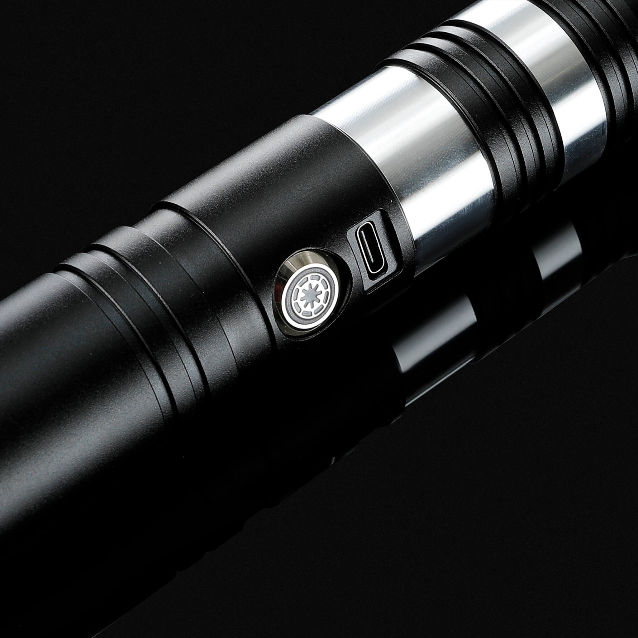 Close up of tactile power button and Type-C charging port on tactical metal hilt saber