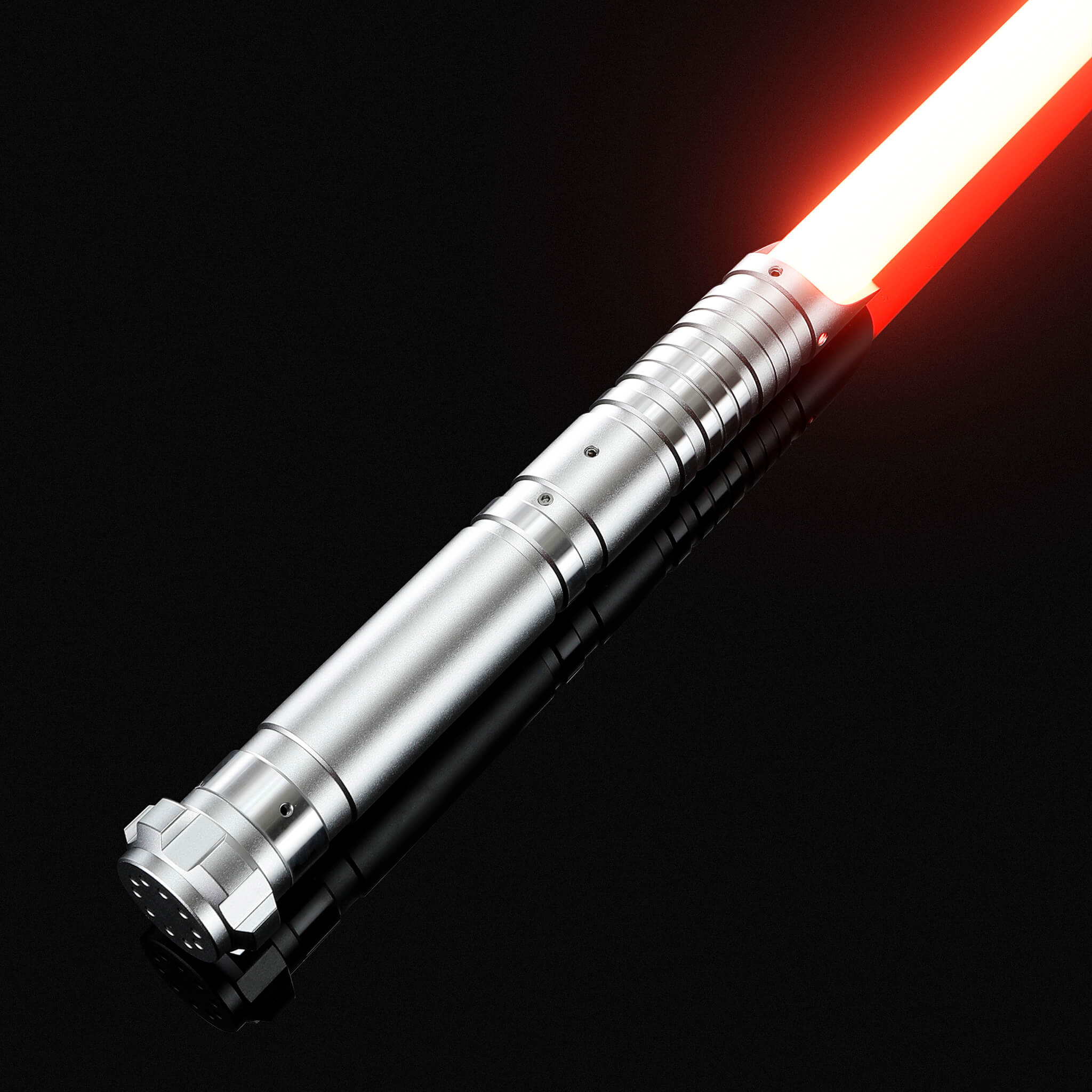 Titanium gray metal hilt replica light saber glowing with a bright red blade.