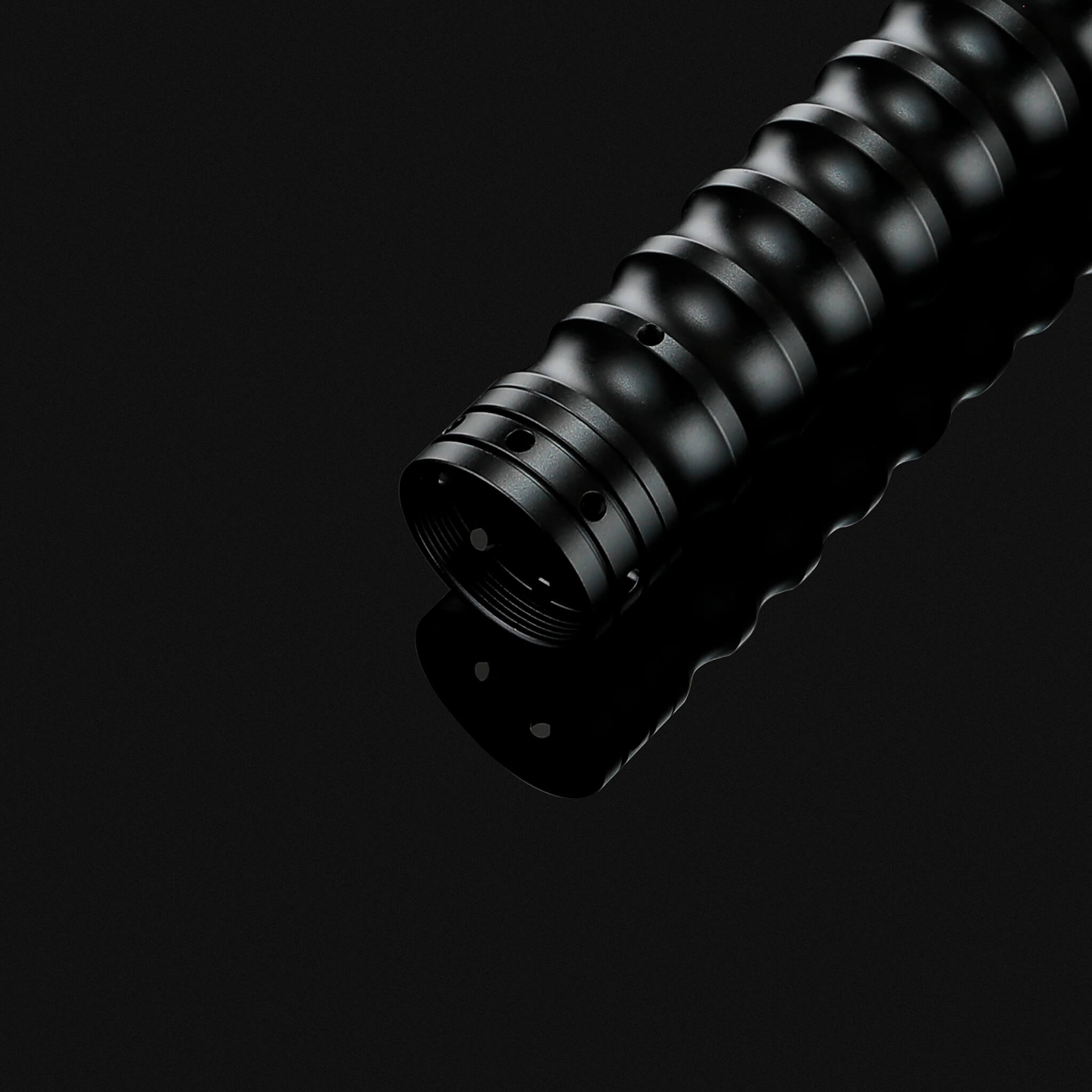 Pommel bottom detail of metal hilt dueling lightsaber