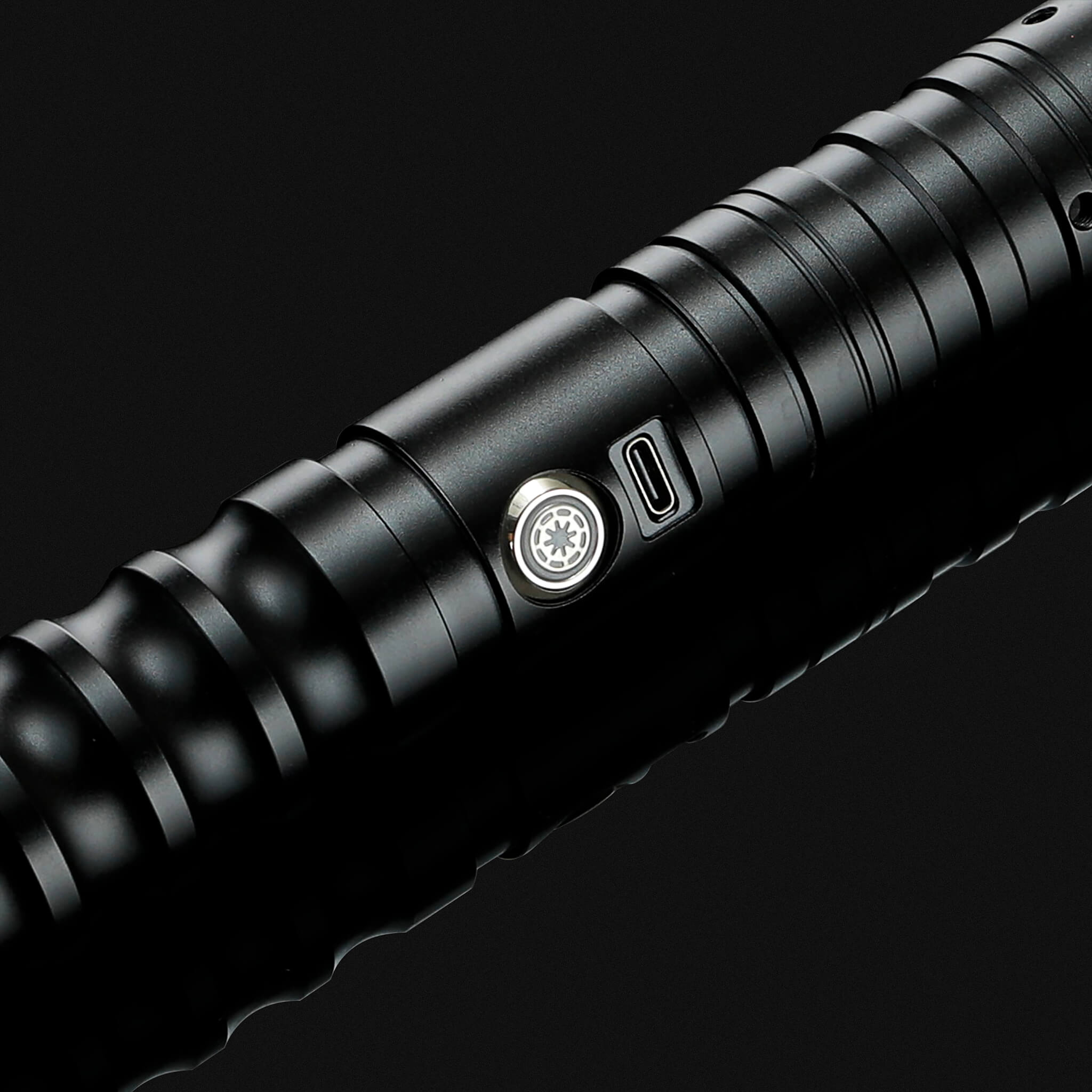 power button on heavy dueling metal lightsaber hilt
