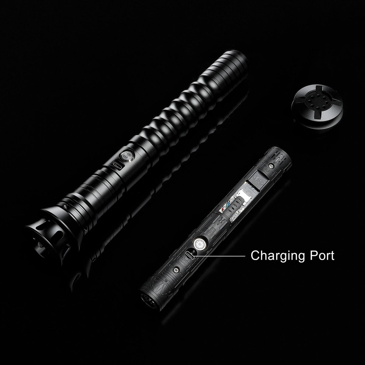 Disassembled black metal lightsaber showing chassis and internal parts